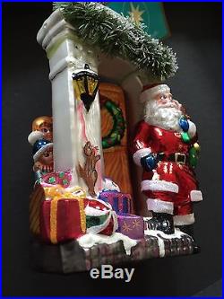 Santa Claus delivering presents Christopher Radko Art Glass Christmas Ornament